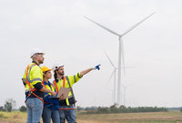 engineers looking at a wind turbine