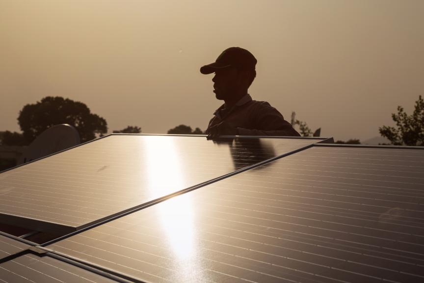 engineer installing solar panel